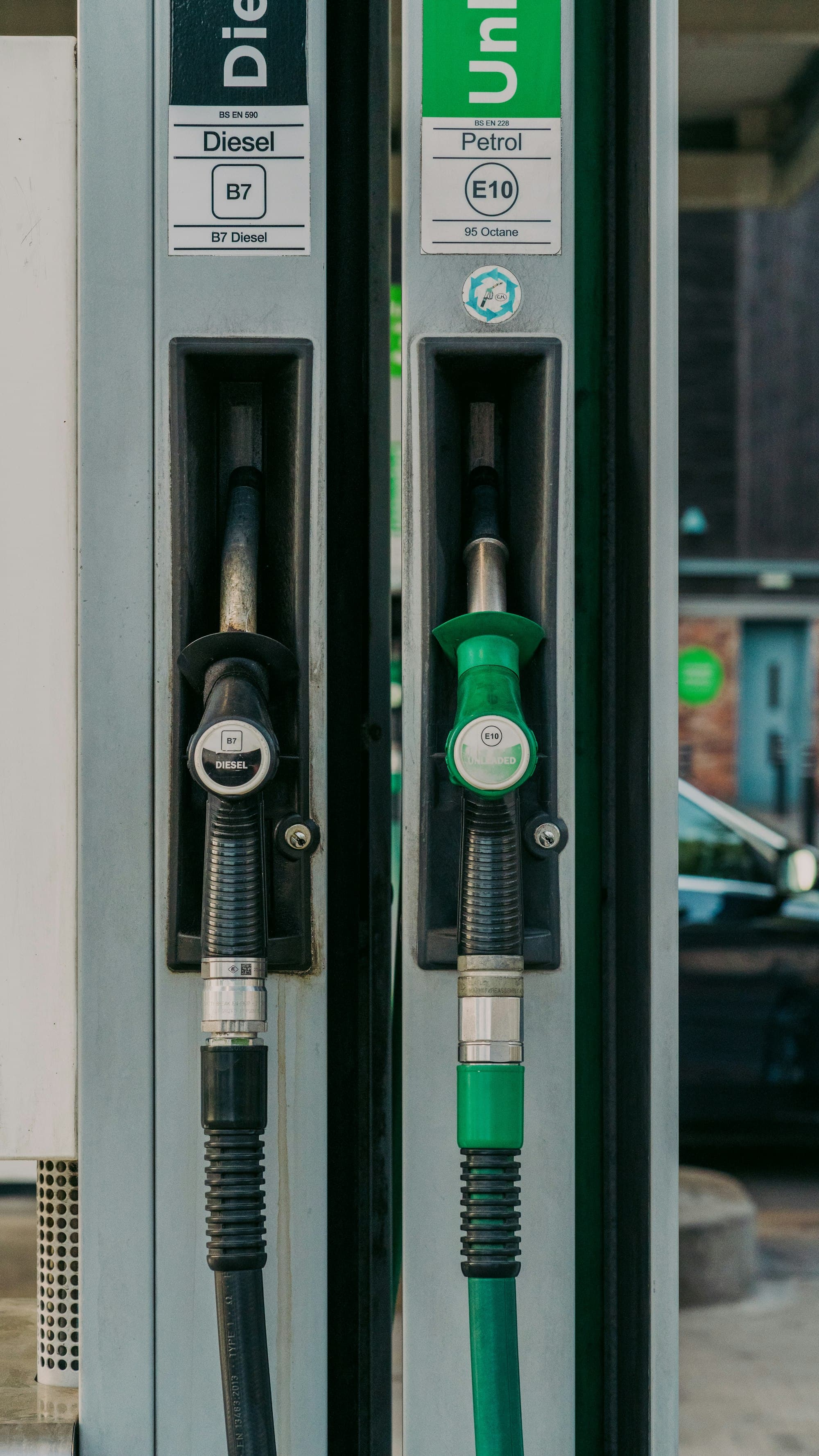 A diesel nozzle and a petrol nozzle on a fuel pump. Not a photograph of the SPR bunk, and not a named fuel company.